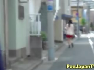 Japanes young woman Peeing Outside